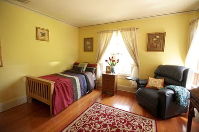 Comfortable private resident room with warm colors