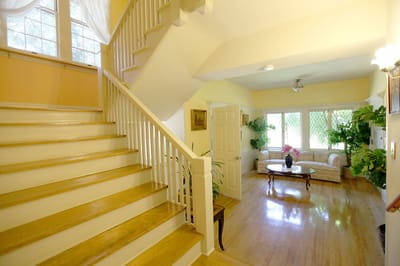 Interior view of a bright common area with stairs