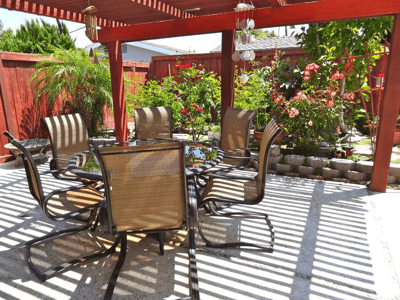 Outdoor dining area with chairs and plants