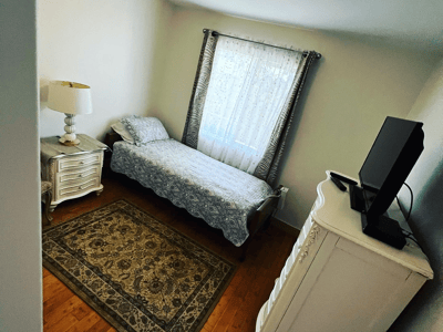 Cozy private room with bed and furnishings