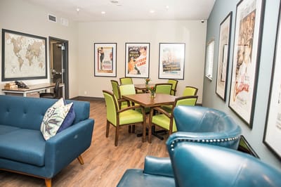 Bright common area with seating and artwork on the walls