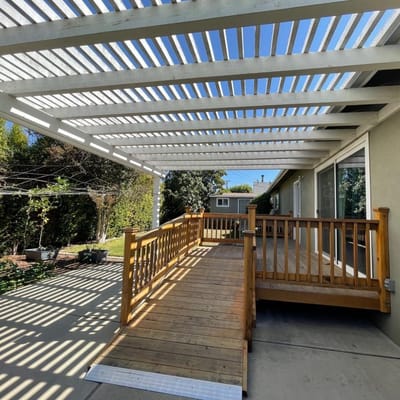 Wooden outdoor deck with shaded pergola