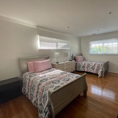 Cozy resident room with two beds and natural light