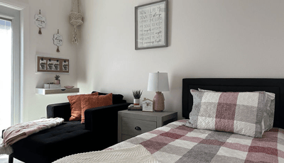 Cozy interior of a resident room with bedding and decor