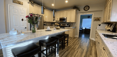 Bright kitchen area with marble countertops