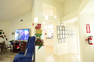 Bright common area with decorations and a TV