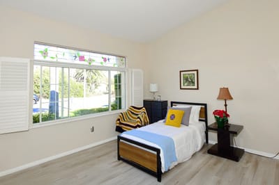 Cozy resident room with a bed and window