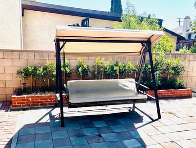 A peaceful outdoor swing in a garden area
