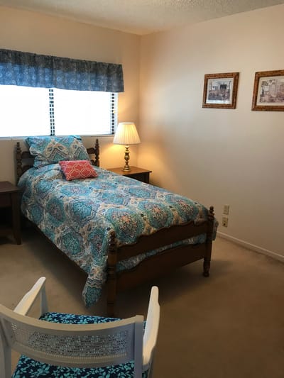 Cozy resident bedroom with a colorful comforter