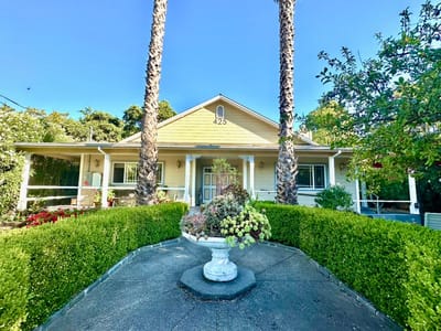 Exterior view of a senior care home with landscaping
