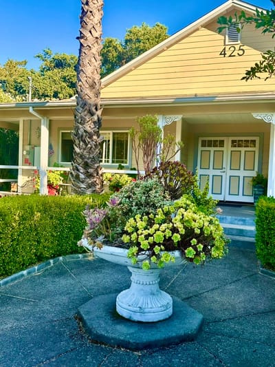 Exterior view of a home with flowering plants
