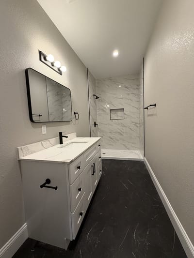 Modern bathroom layout with shower and vanity