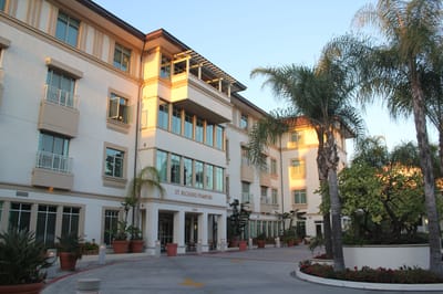 Exterior view of St. Richard Pampuri facility with landscaped entrance
