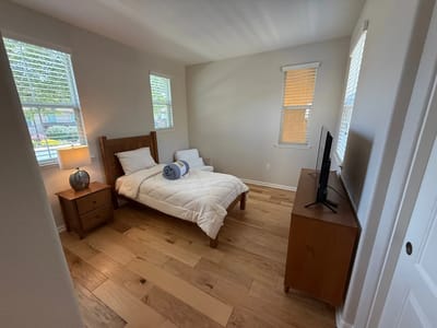 Cozy private resident room with bed and TV