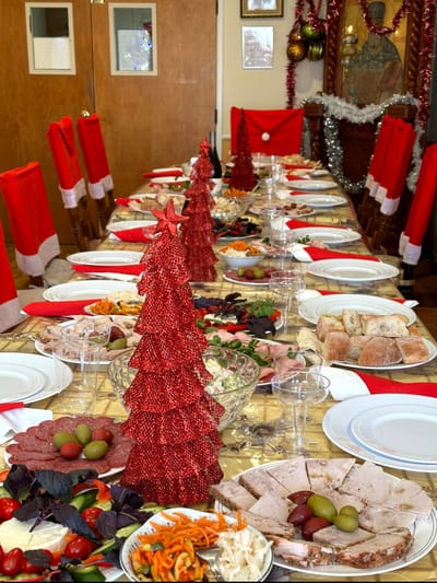 Festively decorated dining table with holiday food spread