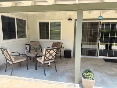 Cozy outdoor seating area with chairs and a table