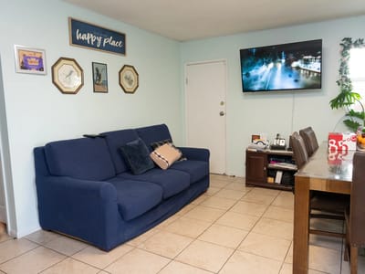 Cozy common area with a couch and TV