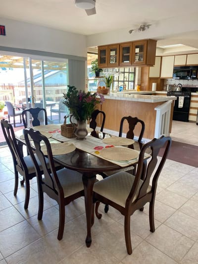 Bright dining area with a table set for meals