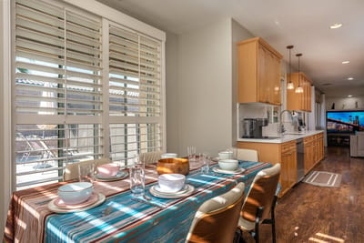 Bright dining area with a table set for meals