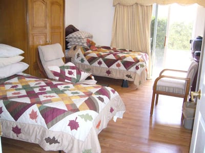Private bedroom with two beds and a cozy setting