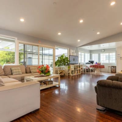 Bright common area with seating and plants