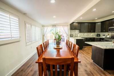 Bright and inviting common area with a dining table