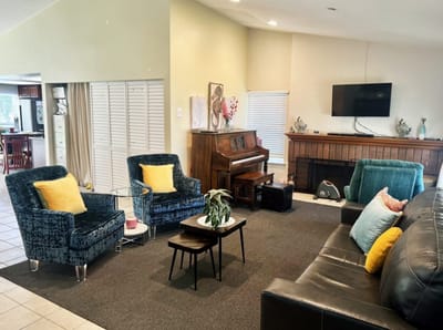 Cozy common area with seating and piano
