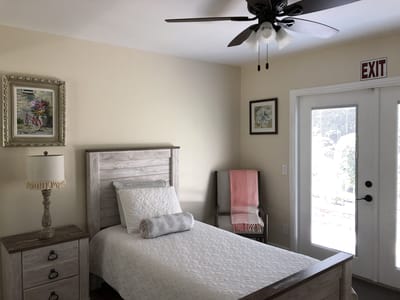 Bright and welcoming bedroom interior with exit door