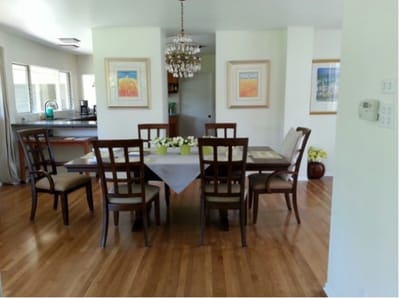 Bright dining area with wooden dining table and chairs