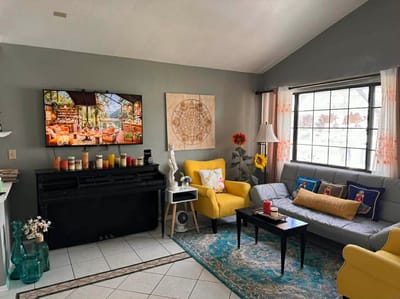 Bright, welcoming common area with seating and decor