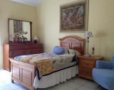 Cozy private room with bed and furniture