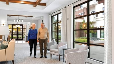 A couple walking in a bright common area