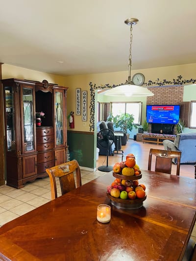 Dining area with fruit centerpiece and a cozy atmosphere