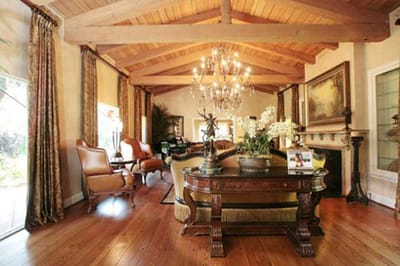 Elegant common area with wooden beams and chandelier