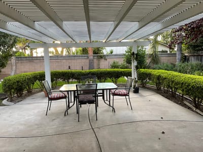 Outdoor seating area with a table and chairs