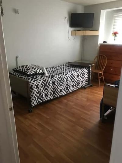 Private resident room with a bed and furniture