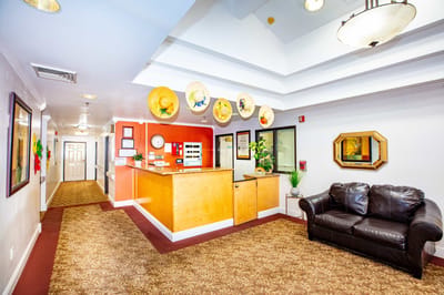 Bright interior lobby with reception desk and seating