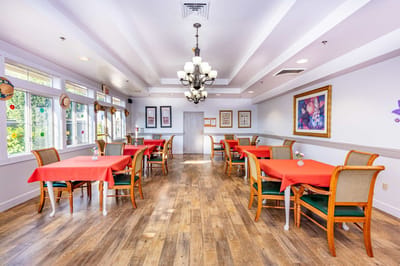 Bright dining area with red tablecloths