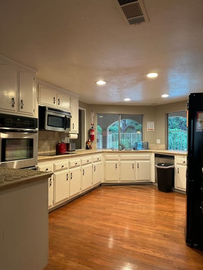 Bright and spacious kitchen area with wooden floors