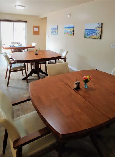 Interior view of a dining room with tables and chairs