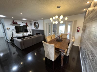 Spacious common area with a dining table and seating