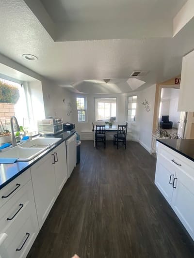 Bright kitchen area with dining table in a senior care facility