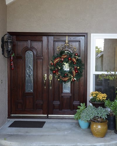 Festive double doors decorated for the holidays