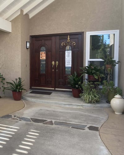 Entrance doors with plants outside