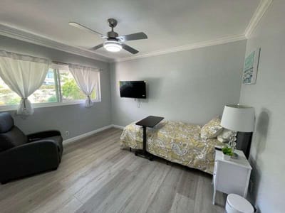 Private resident room with a bed and a chair