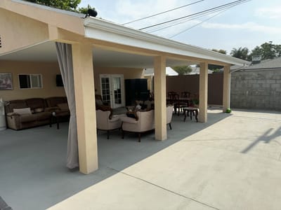 Outdoor seating area with couches and chairs