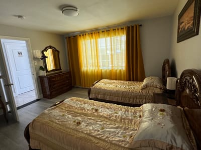 Bright and inviting resident room with two beds