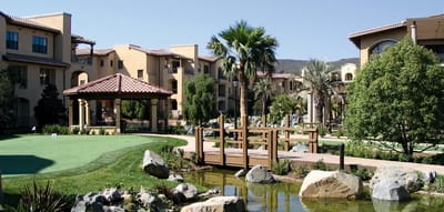 Scenic view of landscaped outdoor area with pond