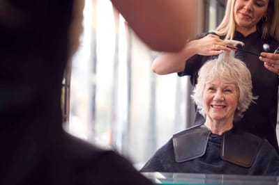 Resident getting a haircut in a salon