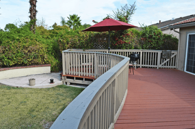 Outdoor patio area with a table and umbrella
